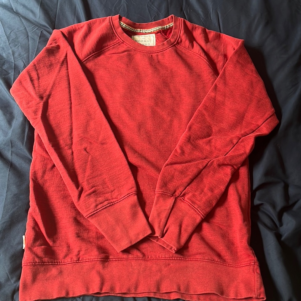 Red crew neck sweatshirt from The Normal Brand